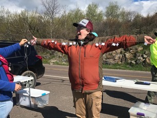 Naturalist Sara measuring her wingspan