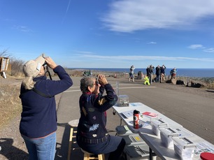 Volunteers Ruth & Gail watching migration at visitor table Volunteers Ruth & Gail watching migration at visitor table