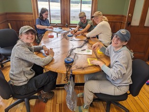 Banding Staff helping repair nets on rainy day Banding Staff helping repair nets on rainy day