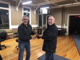 HRBO Board Chair Jim Sanders presenting 10-year service award to  Research Chair Matt Etterson 2024