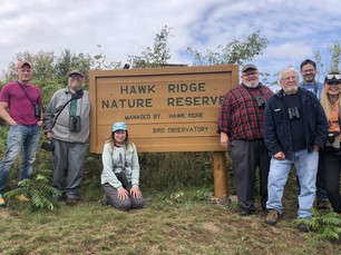 Hawk Ridge staff through the decades with Dr. Laurie Goodrich (center)
